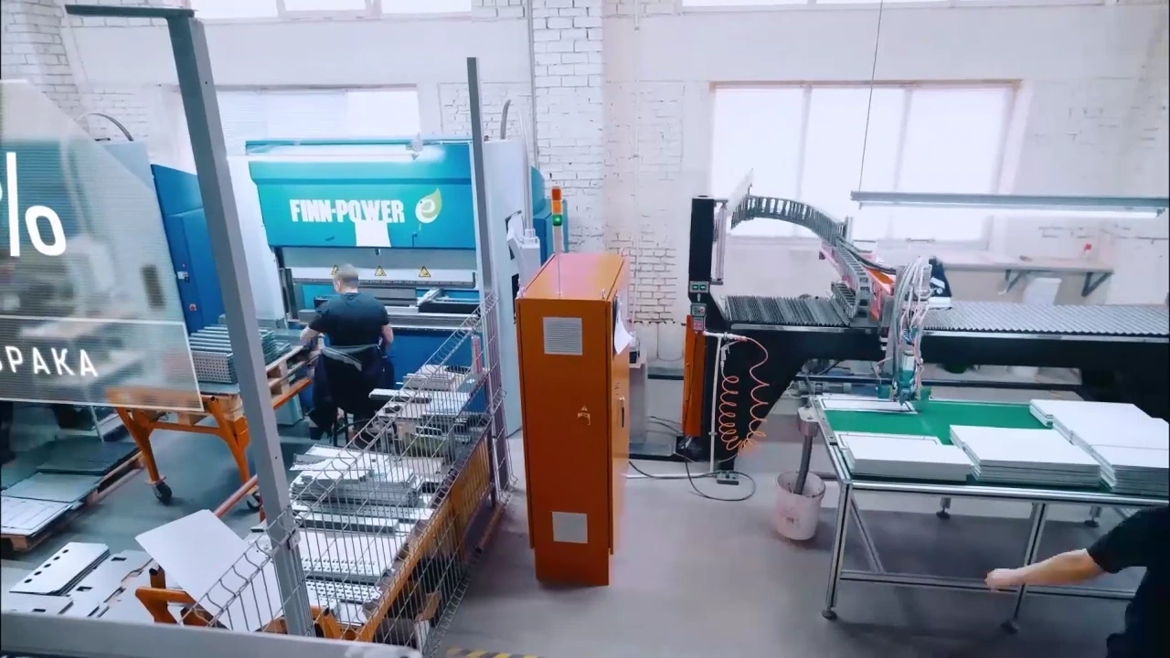 Wide view of Electric Steel Box equipment, from the film